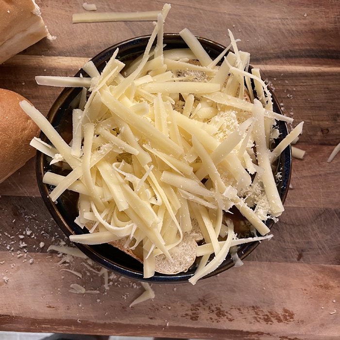 French Onion Soup: cover with cheese